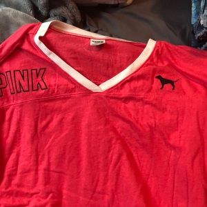 pink women’s shirt